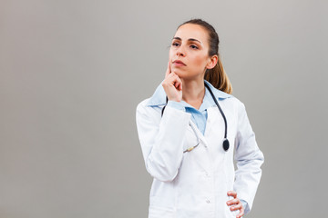 Worried female doctor thinking