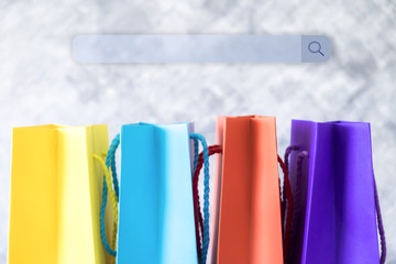 Background of shopping online concept, blur colorful shopping bag yellow blue red and purple. Search engine input box or web address bar. - obrazy, fototapety, plakaty