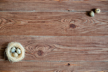 Wooden backgrond with quail eggs