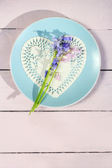Beautiful bluebells on wooden background, romantic love concept