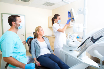 Fototapeta premium Adult woman getting her checkup at the Dentist