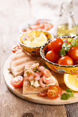 Pita toasts with shrimps and hummus