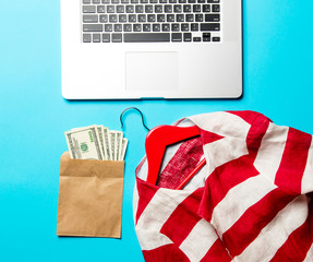 money, jacket, hanger and laptop