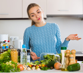 Doubting girl thinking what to cook for dinner