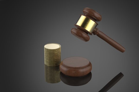 gavel judge with stack of coins