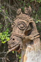 Chettinad, India - October 16, 2013: Ayyanar, village protector, Horse shrine of Namunasamudran. Old clay horse head is brown and beige with black mold spots.