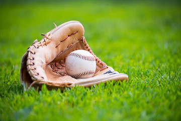 Baseball & Glove on Baseball Field