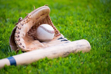 Baseball & Glove on Baseball Field