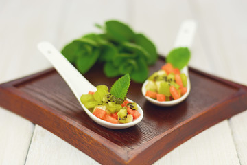 Amuse made of watermelon banana and kiwi