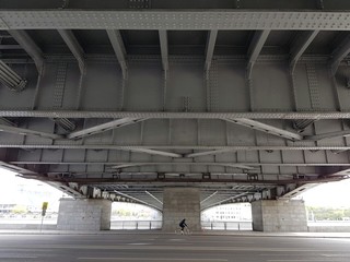Cyclist under the bridge