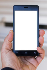 A man holding mobile smartphone in outdoor with blank screen