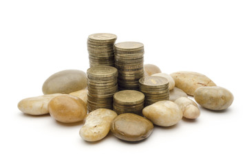 coins and stones on the white background