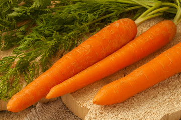Organic carrots on a wooden surface, farm food,GMO free.