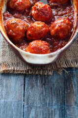 Meatballs in sweet and sour tomato sauce.