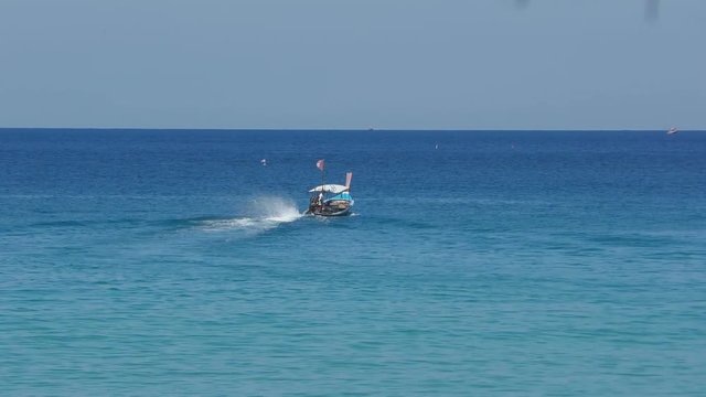 Longtail motor boat in ocean