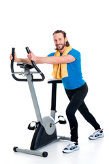 Obraz na płótnie Canvas young man train with fitness machine