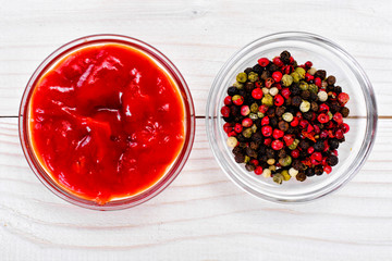 Ketchup, a Mix of Peppers on a Wood Board Background