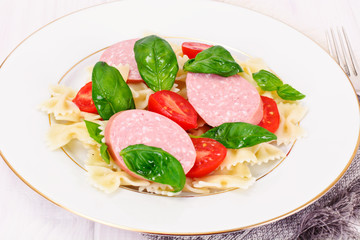 Pasta Bow with Diced Carrots, Salami and Green Peas