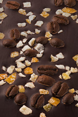 Dark chocolate with coffee grains and fruits. 