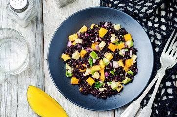 Mango avocado red onion black rice salad