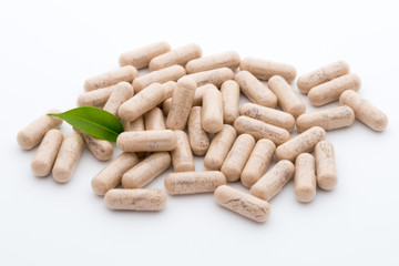 Ginkgo biloba capsule on the white background.