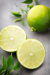 Fototapeta na wymiar Juicy ripe lime an gray table.