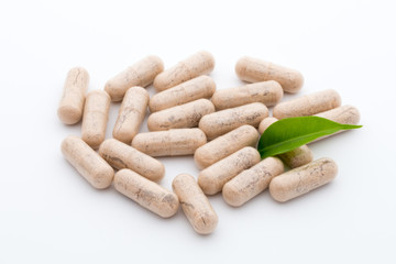 Ginkgo biloba capsule on the white background.