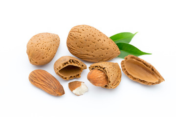 Almonds with leaves isolated on white background