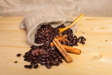 coffee beans in a bag with a wooden spoon