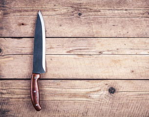 Brown knife on an old kitchen. Cooking, cutting, cooking. On woo