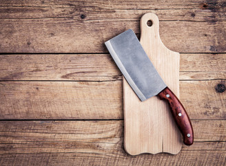 Chopping board block and Meat cleaver large chef's knife on wood