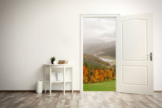 View to mountain landscape through open door