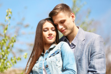Young loving couple in spring park