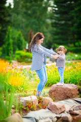 Fototapeta premium Happy mom and daughter. Mom and child girl. Happy family.