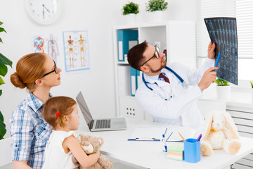 Fototapeta premium mother and child girl on reception at child pediatrician