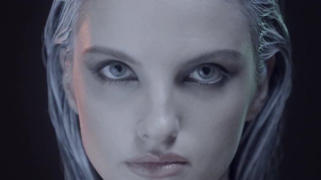 stylish beautiful woman close up - fashion close up shooting of  a professional top model with delicate trendy cool make up style and a futuristic hair style