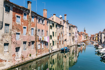 Fototapeta na wymiar Characteristic canal in Chioggia, lagoon of Venice.