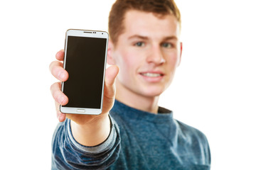 Young man showing black blank phone screen