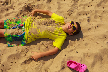 Boy having fun on seaside.