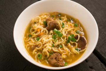Asian quick noodles on wood background photo