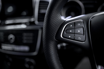 car control buttons ; Interior details.
steering wheel with system of safety speakerphone and radeo