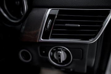 Obraz premium Luxury car dashboard - Air conditioner in luxury car ; Interior detail. - air flow 