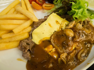 Grilled beef steak with cheese