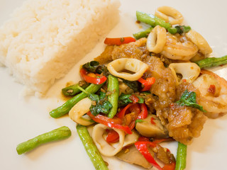 Rice with stir-fried seafood and basil