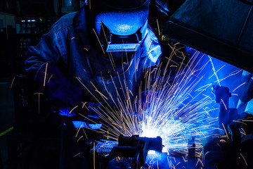 Industrial steel welder in factory