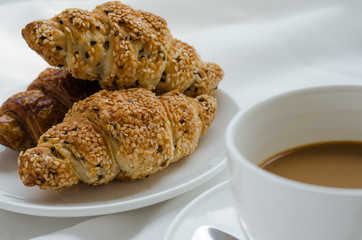 Sesame Croissant and Hot Coffee for Breakfast.