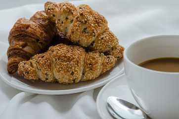 Sesame Croissant and Hot Coffee for Breakfast.