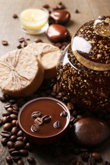 Composition of spa treatment, flowers and coffee beans on wooden background
