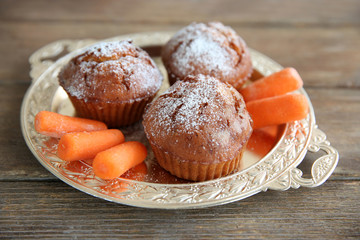 Carrot muffins  on a golden plate