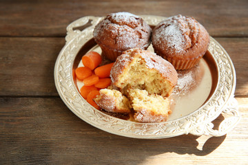 Carrot muffins  on a golden plate